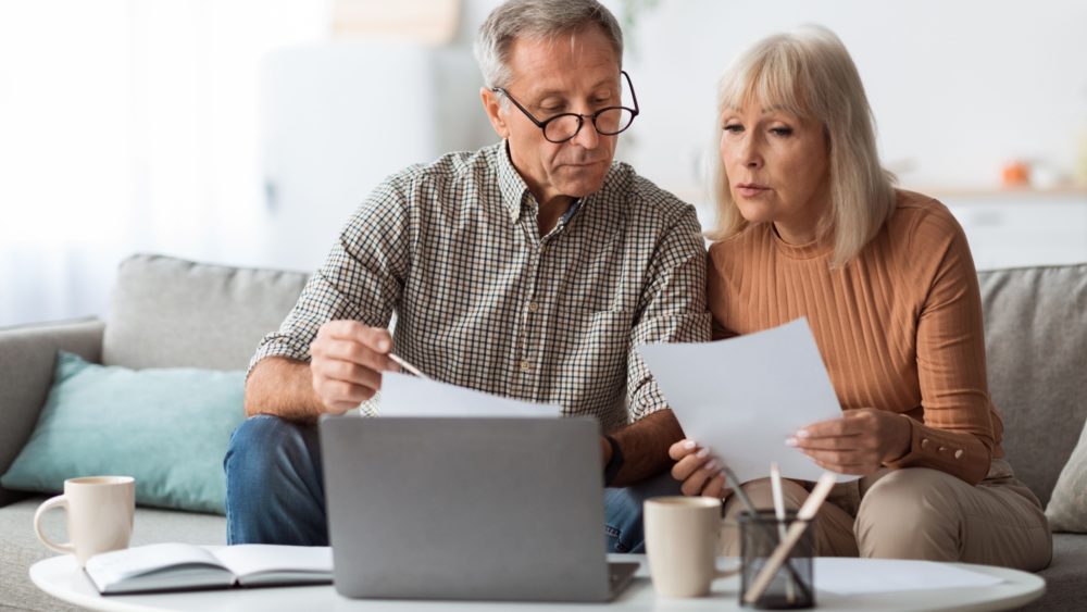 A couple reviewing paperwork together.