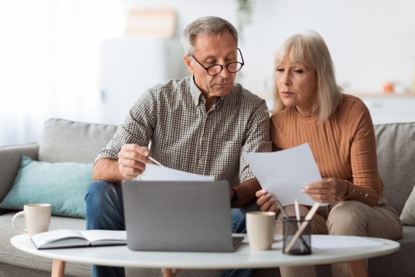 A couple reviewing paperwork together.