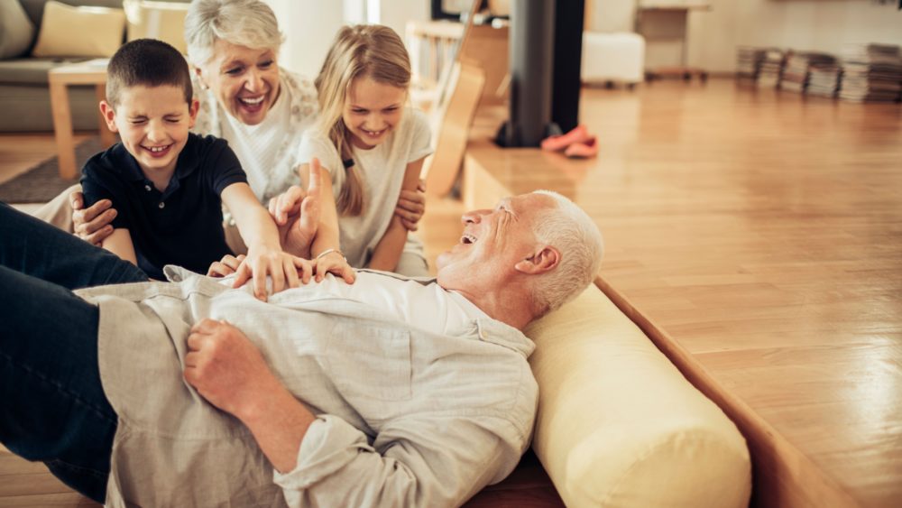 Grandparents playing with their grandchildren.