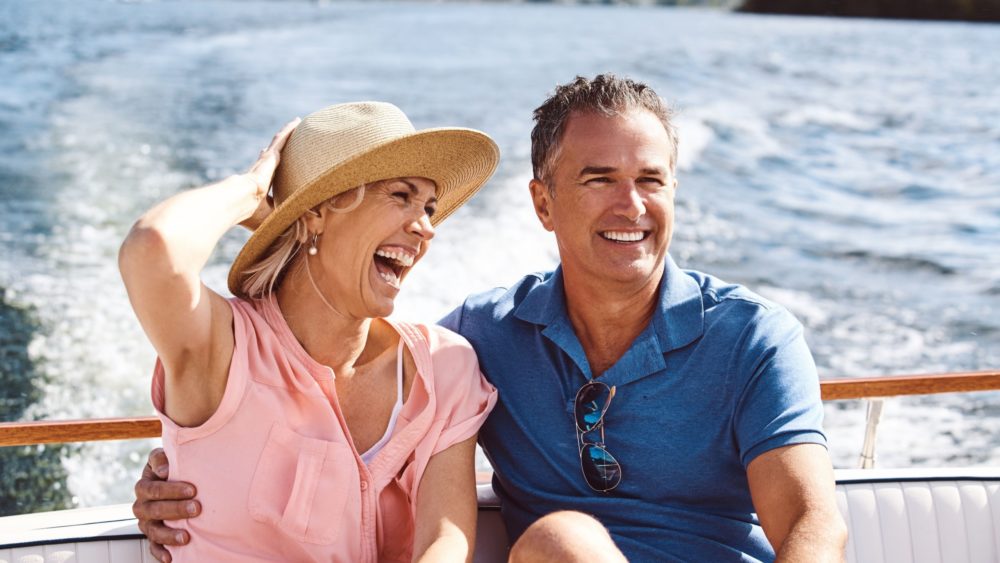 A couple on a yacht cruise.