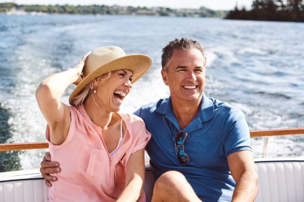 A couple on a yacht cruise.