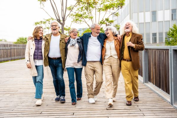 A group of people walking together and laughing.