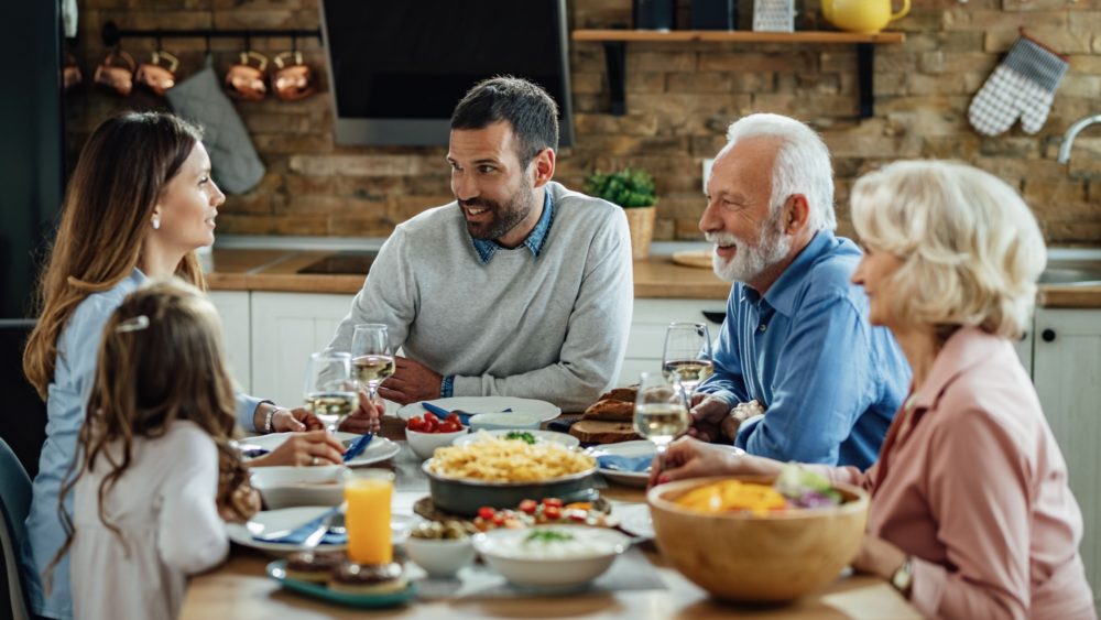 Multiple generations enjoying a family dinner.