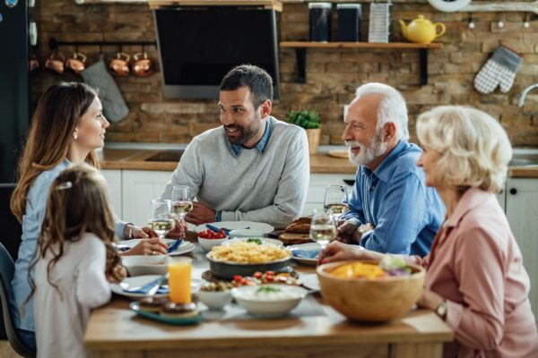 Multiple generations enjoying a family dinner.