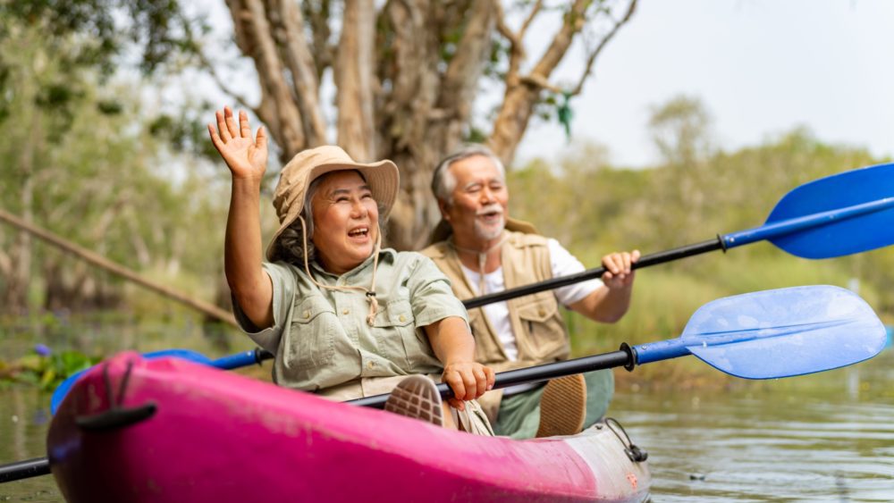 An older couple kayaking.