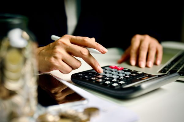 A person using a calculator.